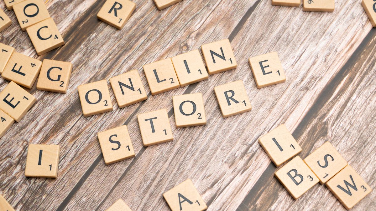 Scrabble tiles spelling 'online store' on a rustic wooden background